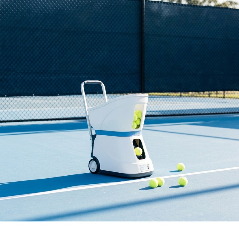 Ball machine on a tennis court
